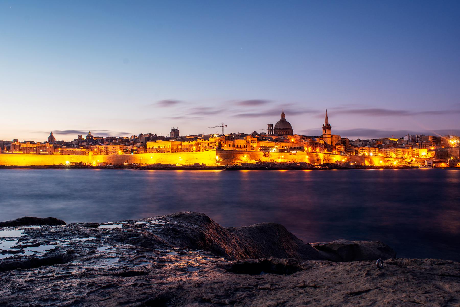 Valletta, Malta illuminated at night across the water